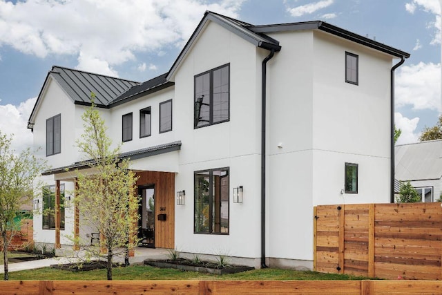 3607 Garden Villa Ln, Austin, TX 78704 - view of front of home featuring a standing seam roof, stucco siding, and a metal roof