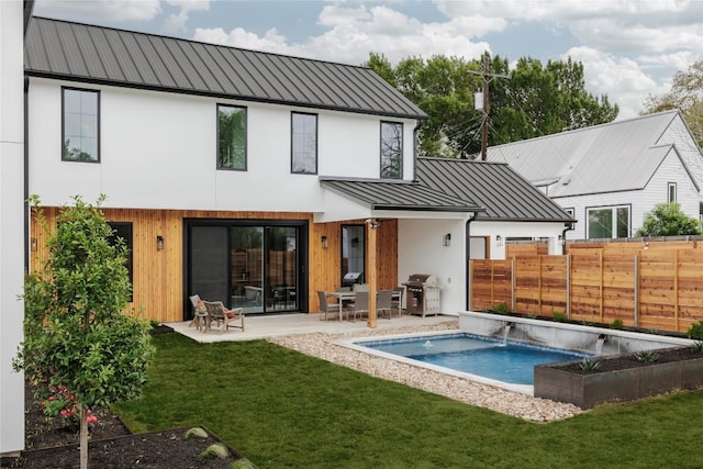 3607 Garden Villa Ln, Austin, TX 78704 - back of property with a standing seam roof, a metal roof, a patio, and stucco siding