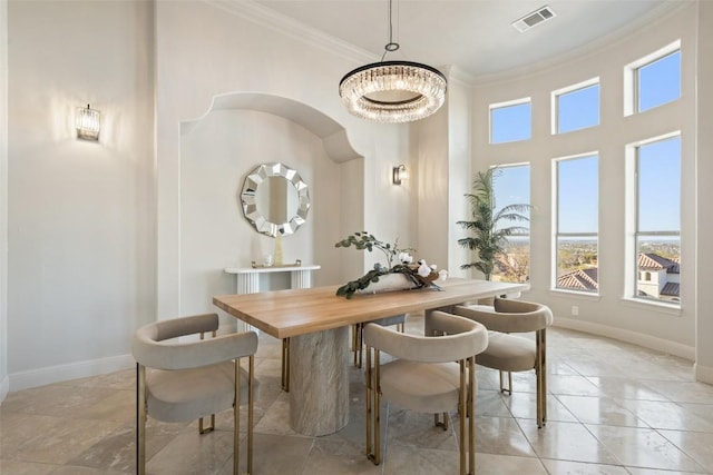 11901 Preserve Vista Ter, Austin, TX 78738 - dining area featuring ornamental molding, baseboards, a chandelier, and a high ceiling