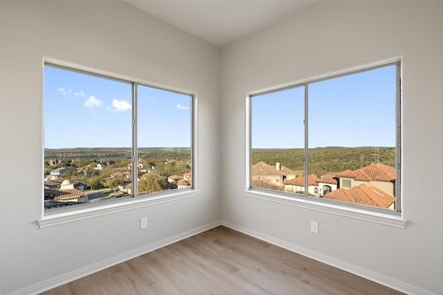 11901 Preserve Vista Ter, Austin, TX 78738 - empty room featuring wood finished floors and baseboards