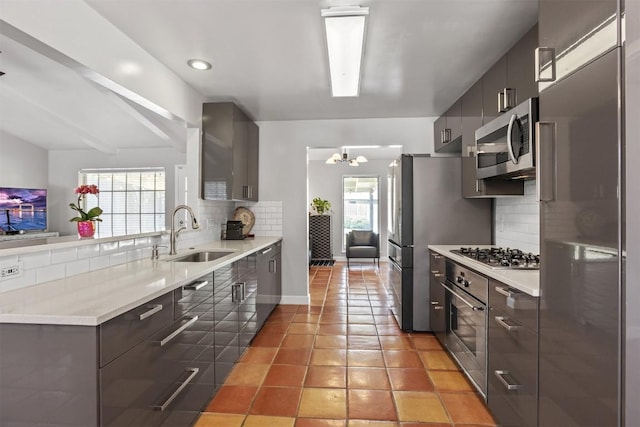1908 Running Brook Dr, Austin, TX 78723 - kitchen with a sink, stainless steel appliances, backsplash, modern cabinets, and recessed lighting
