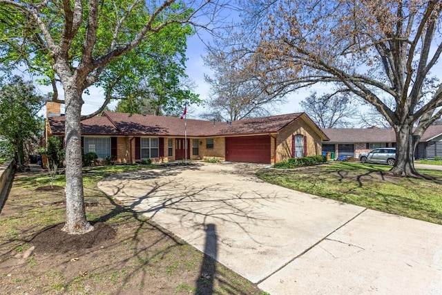 1908 Running Brook Dr, Austin, TX 78723 - ranch-style home featuring a garage, brick siding, and concrete driveway