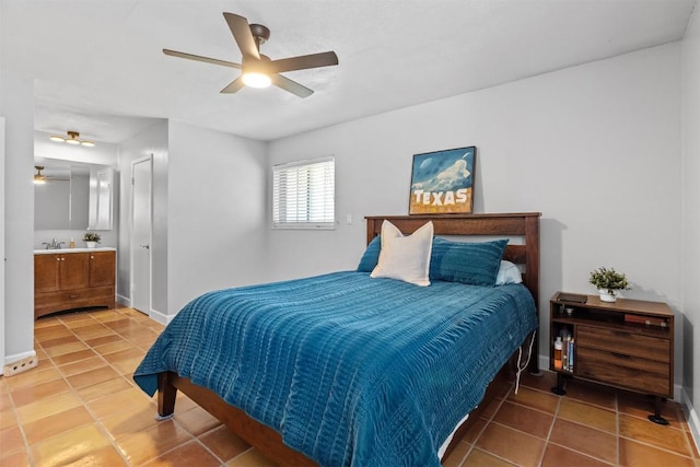 1908 Running Brook Dr, Austin, TX 78723 - bedroom featuring tile patterned flooring, baseboards, ceiling fan, ensuite bath, and a sink
