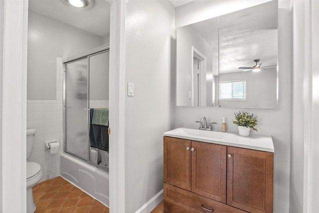 1908 Running Brook Dr, Austin, TX 78723 - full bath featuring a ceiling fan, vanity, toilet, enclosed tub / shower combo, and tile patterned flooring