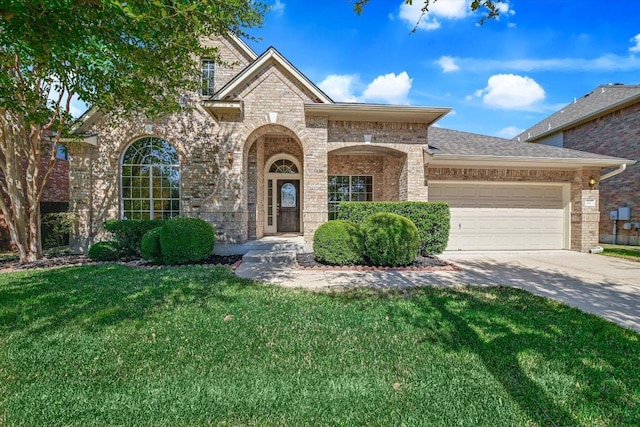 412 Madisons Way, Cedar Park, TX 78613 - view of front of property featuring brick siding, a garage, a front lawn, and concrete driveway
