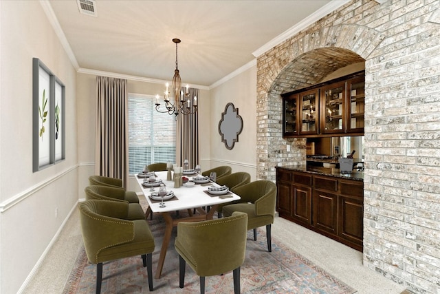 412 Madisons Way, Cedar Park, TX 78613 - dining area with light carpet, a chandelier, and crown molding