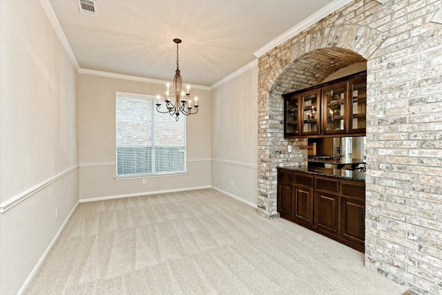412 Madisons Way, Cedar Park, TX 78613 - unfurnished dining area with light colored carpet, a chandelier, and crown molding