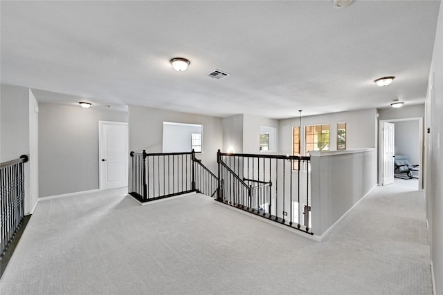 2004 Wood Glen Dr, Round Rock, TX 78681 - hall with an upstairs landing and carpet floors