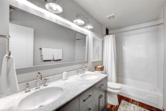 2004 Wood Glen Dr, Round Rock, TX 78681 - full bath with double vanity, shower / tub combo, and wood finished floors