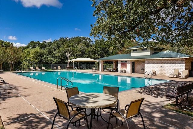 2004 Wood Glen Dr, Round Rock, TX 78681 - community pool with a patio area and view of wooded area