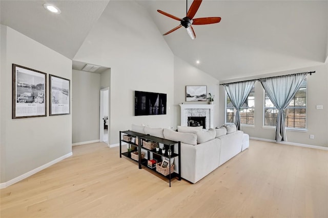 2004 Wood Glen Dr, Round Rock, TX 78681 - living area with ceiling fan, high vaulted ceiling, a fireplace, wood finished floors, and recessed lighting
