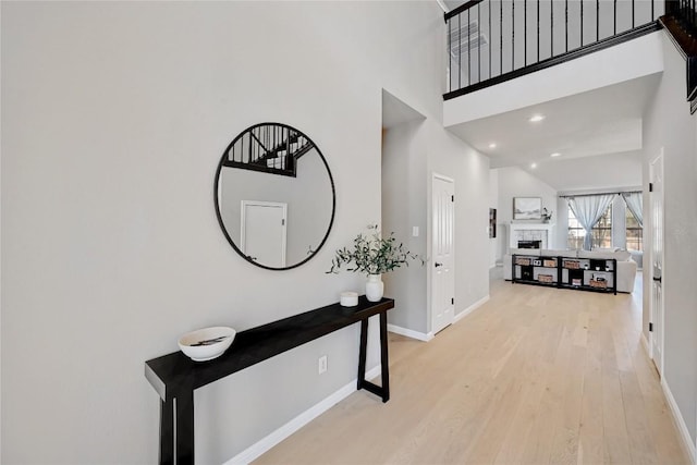 2004 Wood Glen Dr, Round Rock, TX 78681 - hallway with a high ceiling and light wood-style flooring
