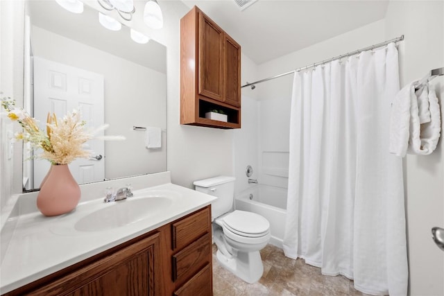full bath with toilet, vanity, and shower / bath combo