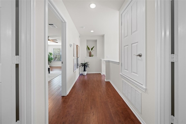 corridor with baseboards, dark wood-style flooring, visible vents, and recessed lighting