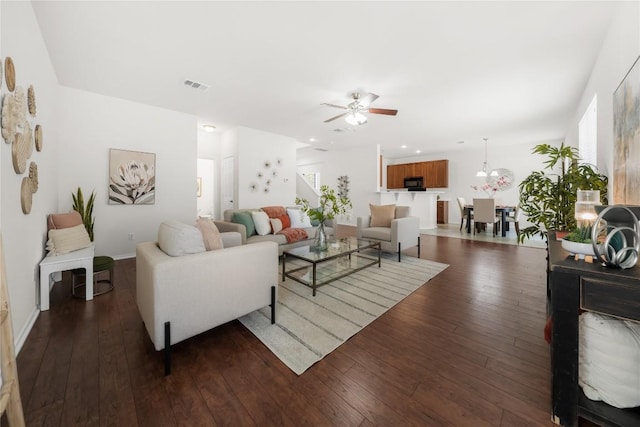 living area with visible vents, baseboards, recessed lighting, a ceiling fan, and dark wood-type flooring