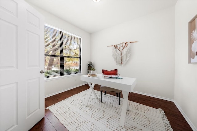 home office with baseboards and dark wood-style floors