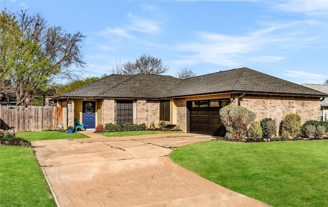 704 Firethorn Ln, Round Rock, TX 78664 - view of front of property featuring concrete driveway, brick siding, an attached garage, and a shingled roof