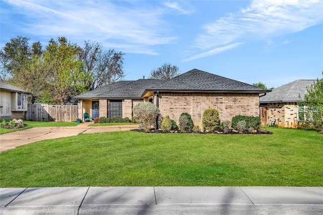 704 Firethorn Ln, Round Rock, TX 78664 - ranch-style house with brick siding and roof with shingles