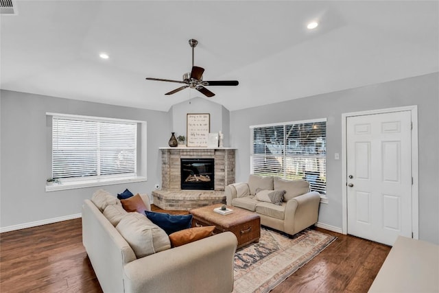 704 Firethorn Ln, Round Rock, TX 78664 - living area featuring ceiling fan, wood finished floors, a fireplace, baseboards, and lofted ceiling