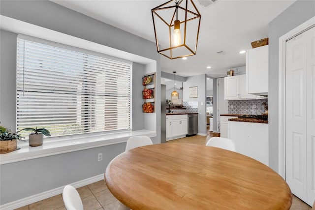 704 Firethorn Ln, Round Rock, TX 78664 - dining area with light tile patterned floors, recessed lighting, and baseboards
