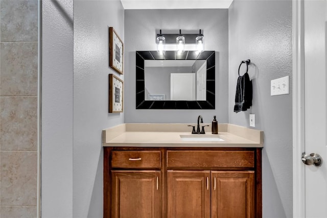 704 Firethorn Ln, Round Rock, TX 78664 - bathroom with vanity and a textured wall