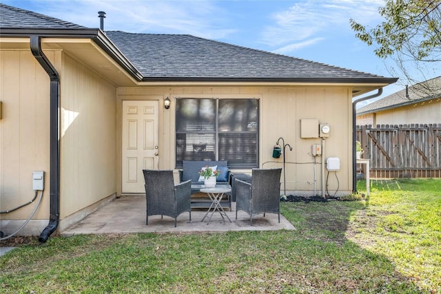 704 Firethorn Ln, Round Rock, TX 78664 - back of house featuring a shingled roof and a patio