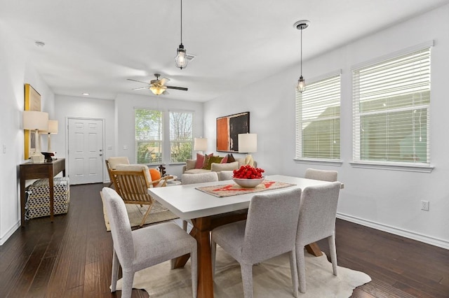 5400 Golden Canary Ln Unit 49, Austin, TX 78723 - dining room with dark wood-type flooring, baseboards, and a ceiling fan