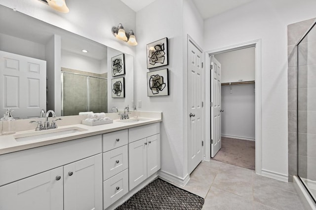 5400 Golden Canary Ln Unit 49, Austin, TX 78723 - full bathroom featuring double vanity, a sink, tile patterned flooring, and a shower stall