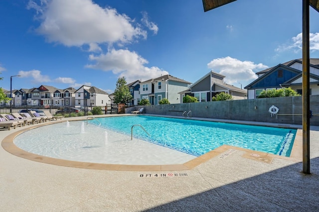 5400 Golden Canary Ln Unit 49, Austin, TX 78723 - community pool featuring a patio, fence, and a residential view