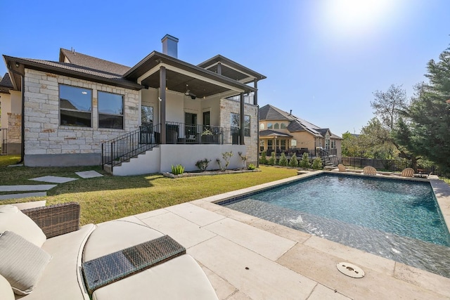 15089 Joseph Dr, Austin, TX 78734 - rear view of property featuring stone siding, ceiling fan, stairway, a chimney, and a patio