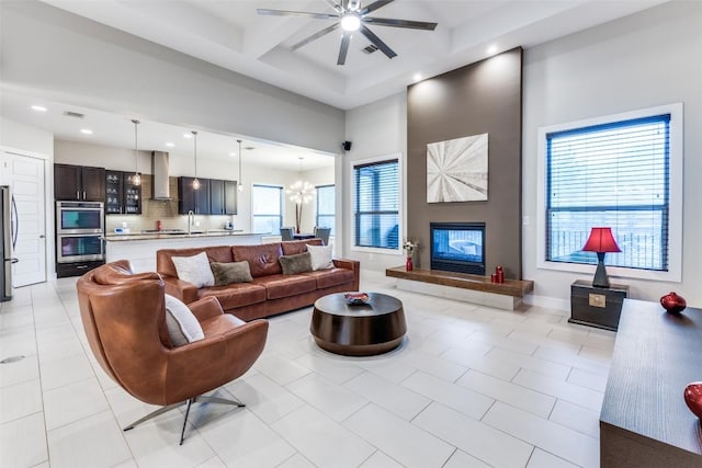 15089 Joseph Dr, Austin, TX 78734 - living area featuring a ceiling fan, recessed lighting, coffered ceiling, beam ceiling, and a towering ceiling