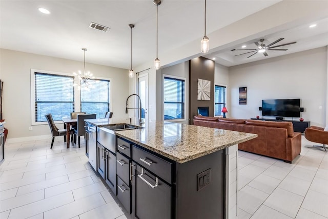 15089 Joseph Dr, Austin, TX 78734 - kitchen featuring a chandelier, stainless steel dishwasher, light stone countertops, a kitchen island with sink, and recessed lighting