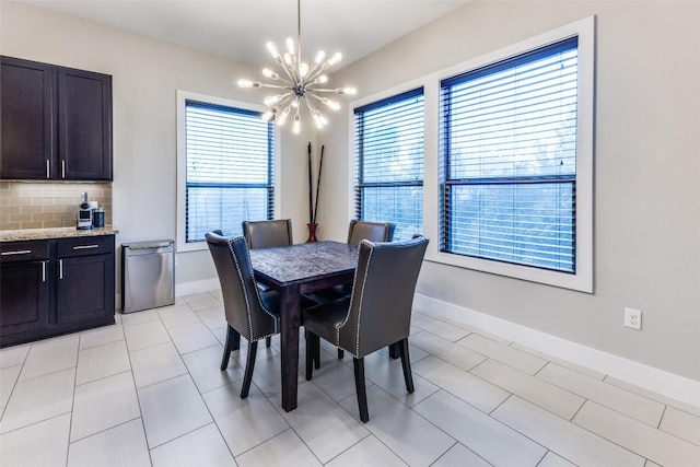15089 Joseph Dr, Austin, TX 78734 - dining area featuring a chandelier and light tile patterned floors