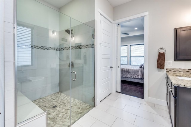 15089 Joseph Dr, Austin, TX 78734 - ensuite bathroom featuring vanity, a shower stall, and tile patterned floors