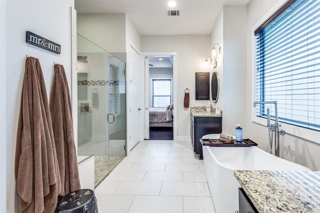 15089 Joseph Dr, Austin, TX 78734 - full bathroom featuring a shower stall, tile patterned flooring, a freestanding tub, ensuite bathroom, and vanity
