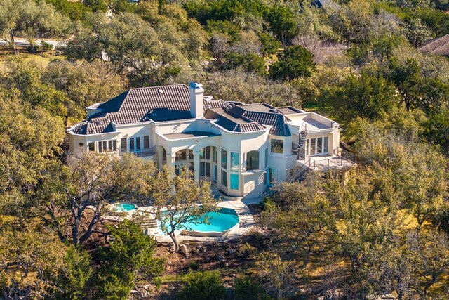 19801 Angel Bay Dr, Spicewood, TX 78669 - aerial view of property and surrounding area with a pool area and a forest