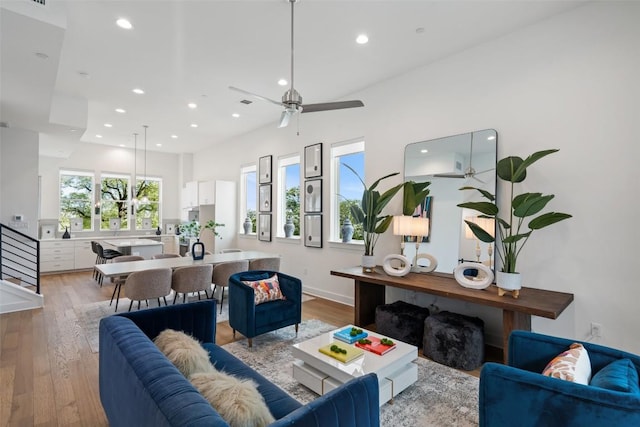 living room with light wood-style floors, recessed lighting, and a ceiling fan