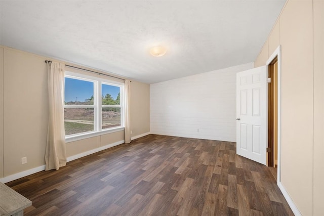 1139 E Old Hallettsville Rd, Flatonia, TX 78941 - spare room with dark wood-type flooring and baseboards