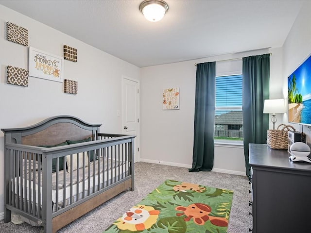 218 Pearland St, Hutto, TX 78634 - bedroom with carpet flooring, baseboards, and a nursery area