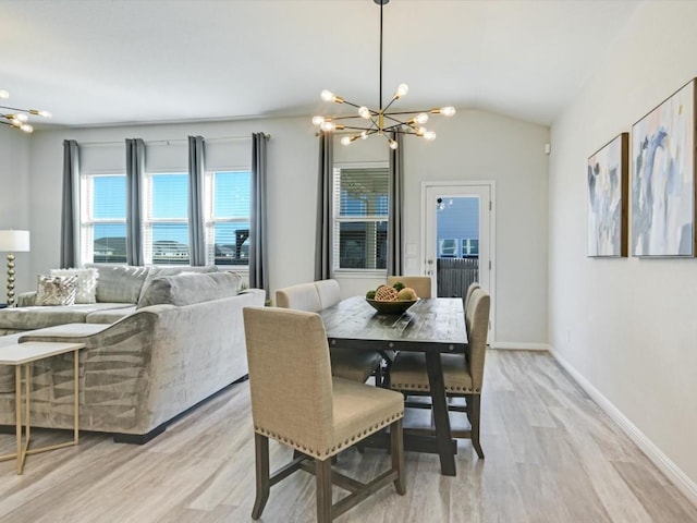 218 Pearland St, Hutto, TX 78634 - dining area with a chandelier, light wood finished floors, lofted ceiling, and baseboards