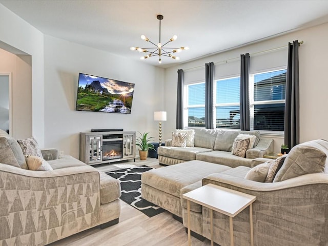 218 Pearland St, Hutto, TX 78634 - living area with a chandelier and wood finished floors
