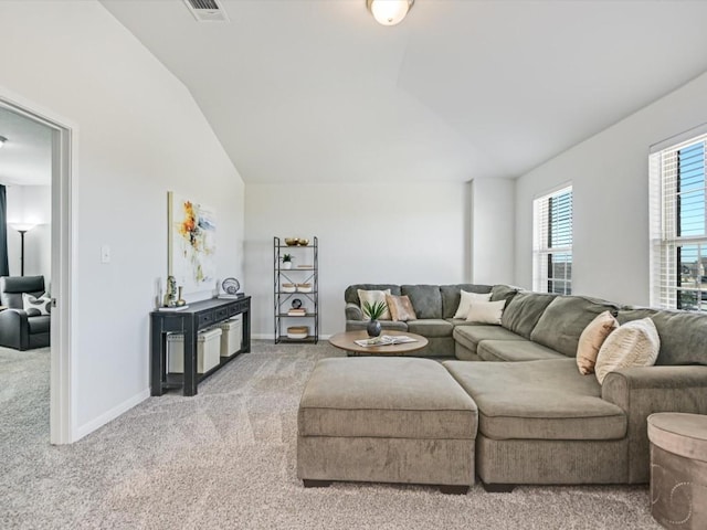 218 Pearland St, Hutto, TX 78634 - living room with light colored carpet, vaulted ceiling, and baseboards