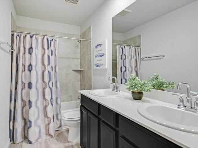 218 Pearland St, Hutto, TX 78634 - full bathroom with shower / bath combo with shower curtain, double vanity, and toilet