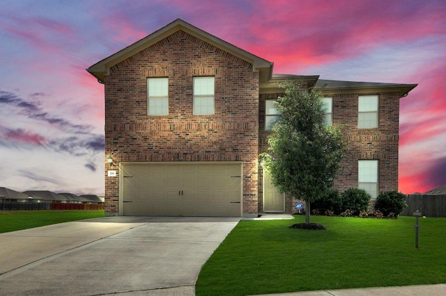 218 Pearland St, Hutto, TX 78634 - view of front of property featuring a garage, driveway, and brick siding