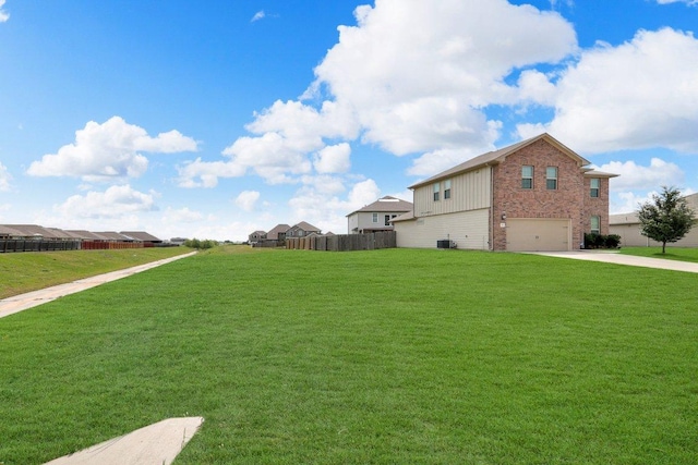 218 Pearland St, Hutto, TX 78634 - view of yard with an attached garage and concrete driveway