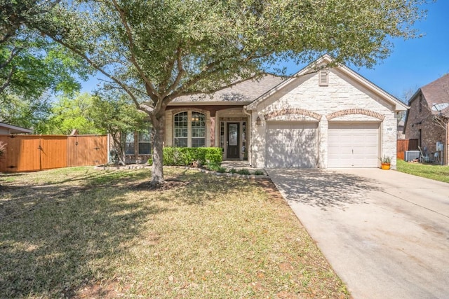 ranch-style home with an attached garage, driveway, a gate, and central air condition unit