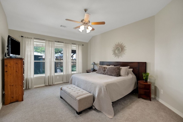 carpeted bedroom with baseboards, a ceiling fan, and lofted ceiling