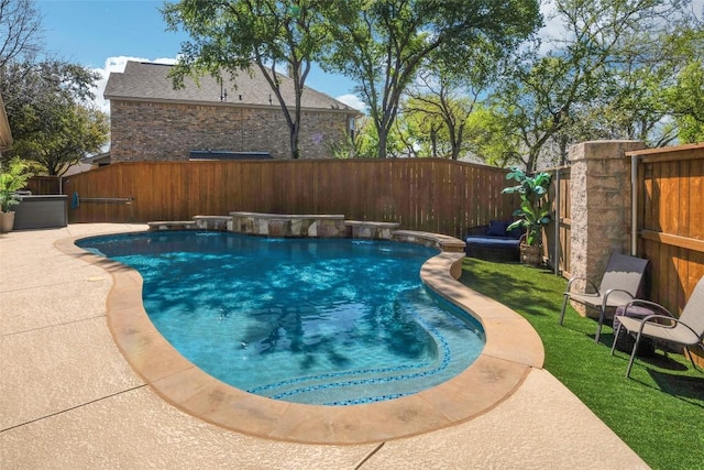 view of swimming pool with a fenced backyard