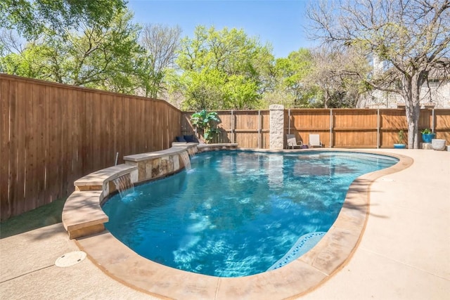 view of pool with a fenced backyard