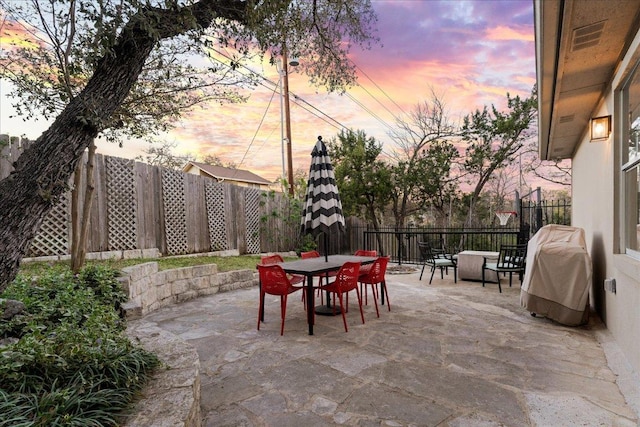 view of patio featuring outdoor dining area and a fenced backyard